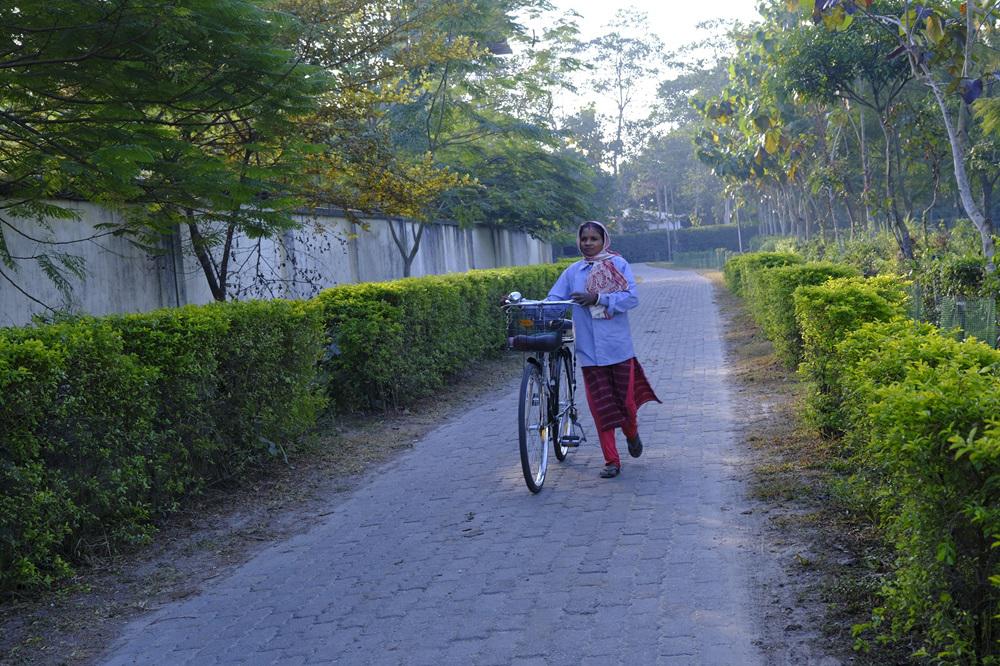 Female worker with the bicycle provided by TPI